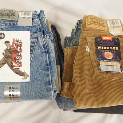 1158	LOT OF NINE PAIRS OF LEVIS JEANS. NEW W/ TAGS, INCLUDING TWO USA MADE CIRCA 80S/90S. SIZES 6, 7, & 8
