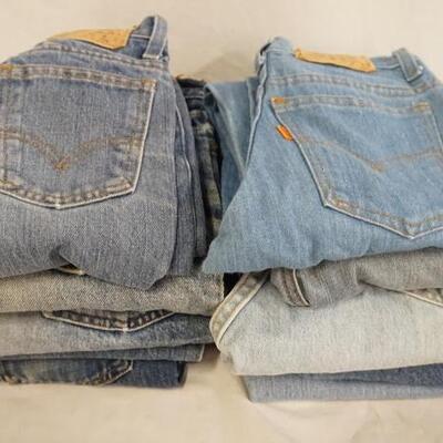 1002	LOT OF TEN PAIRS OF VINTAGE YOUTH SIZED LEVI STRAUSS & COMPANY JEANS W/ ORANGE TABS, VARYING DEGREE OF WEAR
