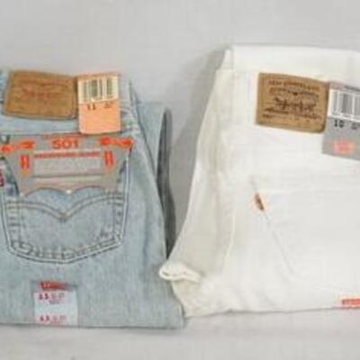 1143	LOT OF FOUR PAIRS OF VINTAGE LEVIS JEANS W/ TAGS; TWO 550 SIZE 10 W/ ORANGE TAB MADE IN USA, 501 SIZE 10 MADE IN USA & 501 SIZE 11...