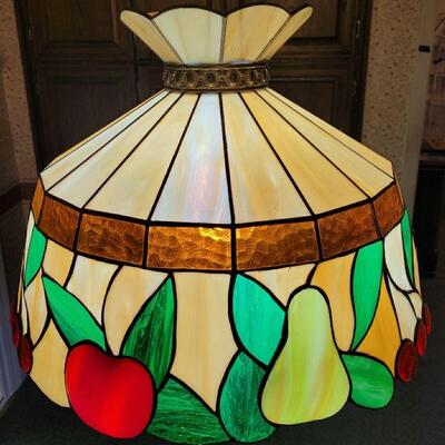 https://ctbids.com/#!/description/share/697691 This is a 70's Tiffany style stained glass fruit lamp. It’s 18