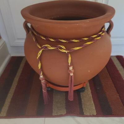 https://ctbids.com/#!/description/share/700648 Large planter is made from clay measures 16