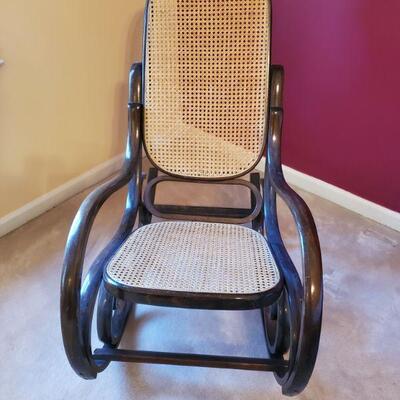 https://ctbids.com/#!/description/share/700563 Cane back wooden rocking chair. Measurements: 22x40x39