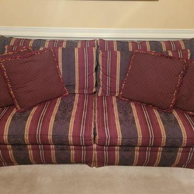 https://ctbids.com/#!/description/share/700654 Bassett burgundy, blue and gold striped sofa. Comes with four throw pillows and two...