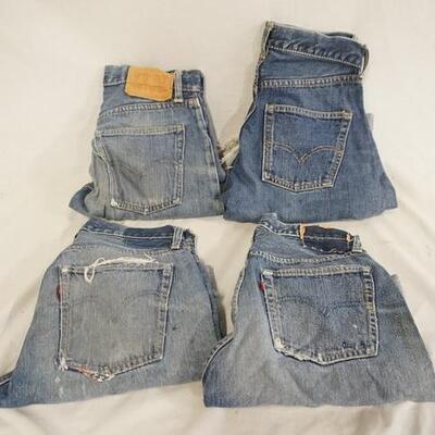 1079	LOT OF FOUR PAIRS OF VINTAGE LEVIS SELVEDGE JEANS THAT HAVE BEEN CUT INTO SHORTS. ONE PAIR WAIST SIZE IS MARKED 28. THE OTHER THREE...