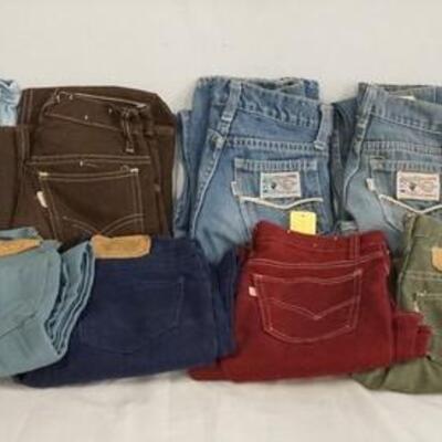 1076	LOT OF 13 PAIRS OF VINTAGE LEVIS PANTS W/ WHITE TABS. ALL ARE YOUTH SIZES. VARYING DEGREES OF WEAR 

