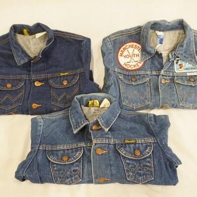 1042	LOT OF THREE VINTAGE WRANGLER DENIM JACKETS ALL ARE MARKED MADE IN USA. ONE JACKET IS DECORATED W/ VARIOUS PATCHES SIZE IS FADED IT...