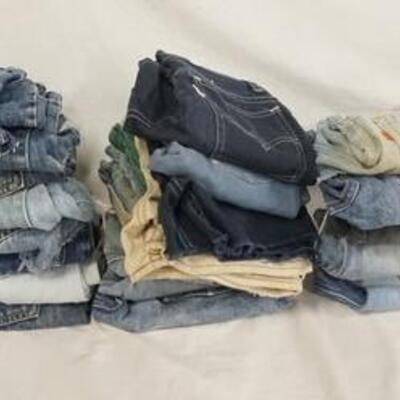 1045	LOT OF 37 PAIRS OF VINTAGE LEVI'S JEANS ALL ARE SHORTS/HAVE BEEN CUT INTO SHORTS. VARYING DEGREES OF WEAR 
