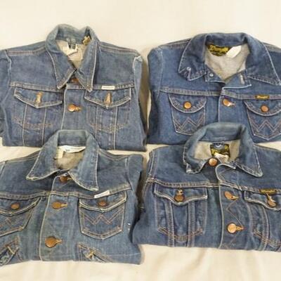1033	LOT OF FOUR VINTAGE WRANGLER DENIM JACKETS, ALL ARE MARKED MADE IN USA. SIZES ARE; 10, 8, 14, ONE SIZE UNMARKED MEASURES APP. 14 IN...