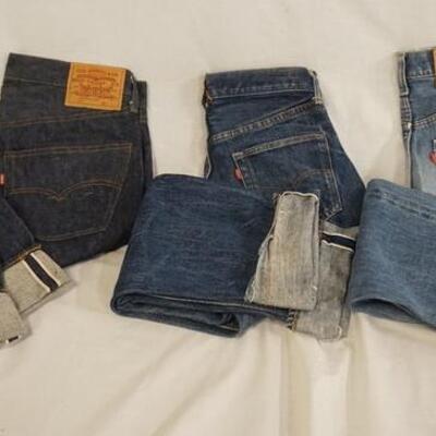 1052	LOT OF THREE PAIRS OF LEVIS SELVEDGE JEANS ONE IS SIZE 32 X 32 REVERSE OF TOP BUTTON IS STAMPED 6, ONE PAIR THE SIZE LABEL IS...