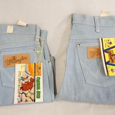1051	TWO PAIRS OF VINTAGE WRANGLER SANFORIZED JEANS BOTH COME W/ COLORING/COMIC BOOKLETS WHICH ARE COPYRIGHT DATED 1959. ONE PAIR IS SIZE...