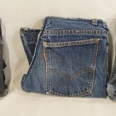 1039	LOT OF THREE PAIRS OF VINTAGE LEVI STRAUSS & COMPANY JEANS W/ ORANGE TABS & BIG E. SIZES ARE; 27 X 34, 28 X 27 & YOUTH SIZE 11....