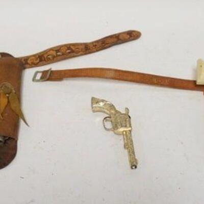1182	GROUP OF 3 ANTIQUE TOY CAP GUNS, 2 IN HOLSTERS, 1 LEATHER BELT WITH DISNEY CHARACTERS	50	100	25	PLEASE PAY ATTENTION FOR DAILY...