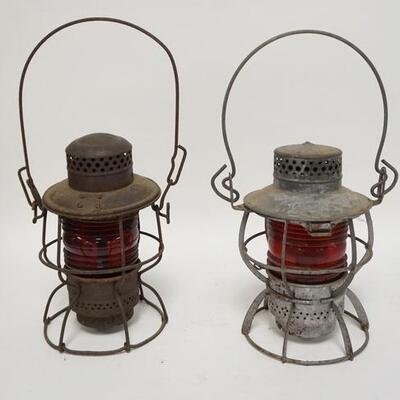 1109	TWO RAILROAD LANTERNS W/ RIBBED RED GLOBES ONE IS ADLAKE & WT CO, ONE IS DRESSEL NJC. 15 IN H 	70	150	25	PLEASE PAY ATTENTION FOR...