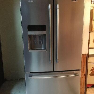 Maytag Refrigerator -French Doors & Bottom Freezer. Measures 36 across x 31 deep and need 69 1/2 clearance for height.
