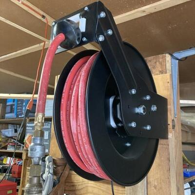 Retractable hose reel. Hose reel with 50’ of hose.