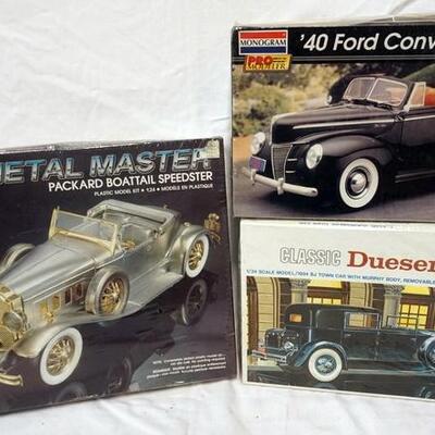 1077	3 MONOGRAM MODEL CAR KITS, DUESENBURG, '40 FORD AND PACKARD BOBTAIL, 2 SEALED. KITS ARE POSSIBLY COMPLETE, NOT GUARANTEED	50	100	10...