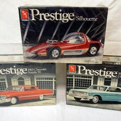 1008	LOT OF 3 AMT ERTL PRESTIGE MODEL CAR KITS, 2 SEALED, 1 OPEN KITS ARE POSSIBLY COMPLETE, NOT GUARENTEED	50	100	10	PLEASE PAY...