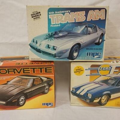 1033	LOT OF 3 MPC MODEL CAR KITS, CORVETTE, FORD EXP, TRANS AM, KITS ARE POSSIBLY COMPLETE, NOT GUARENTEED	50	100	10	PLEASE PAY ATTENTION...