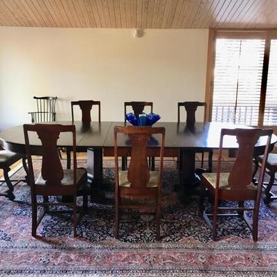 Antique Edwardian dining table with 8 chairs from Texas. When extended the pedestal separates. $1,095
72 X 54