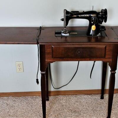 Antique Singer sewing machine with cabinet.