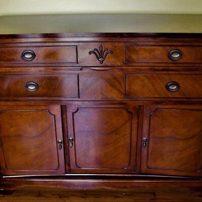 Versatile and beautiful wood credenza is in excellent condition.