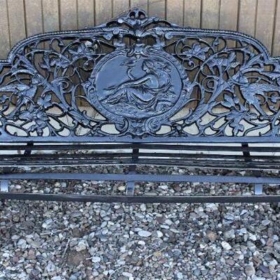 A very ornate and heavy, outdoor bench.  Really sharp.
