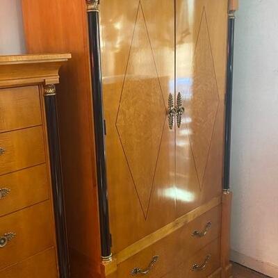 Thomasville curly birdseye maple armoire/wardrobe with black column detail has inside mirror and drawers