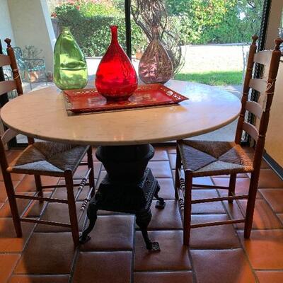 another photo of antique cast iron stove table
(stove by SNAP)