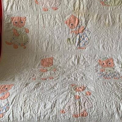 Vintage baby quilt with patch work of cats