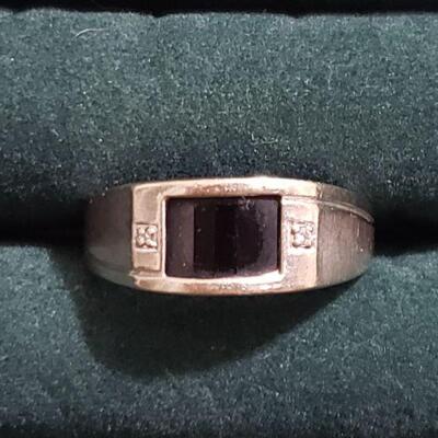 https://ctbids.com/#!/description/share/721122 Handsome 10k white gold ring with diamond accents and what appears to be an onyx center...