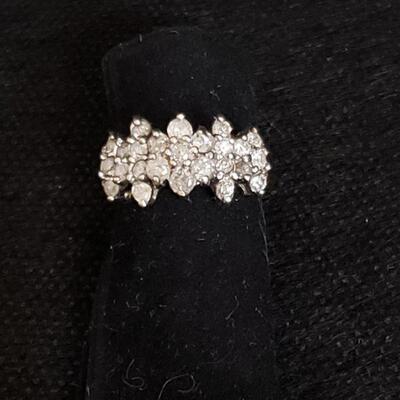https://ctbids.com/#!/description/share/721048 Multi-stone diamond ring with floral shaped center cluster. 10k gold setting and 25...
