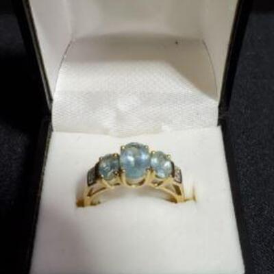 https://ctbids.com/#!/description/share/721119 14K gold ring with three aquamarine stones and diamond accents on the side, size 7. Center...
