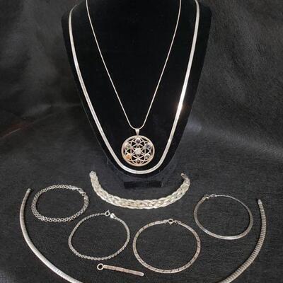 https://ctbids.com/#!/description/share/721150 Beautiful assortment of sterling silver bracelets, necklaces, and pendant. Three bracelets...
