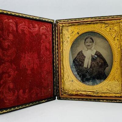 Antique 1860 to 1880 tintype photo of a woman with glasses in a brass, velvet and leather case