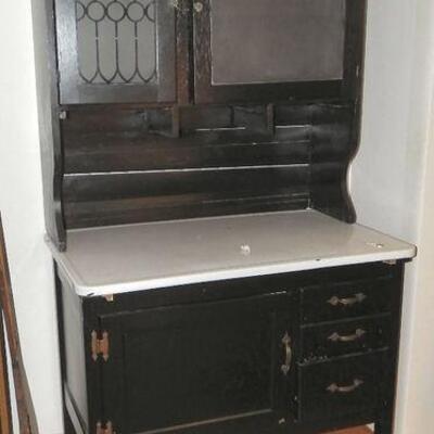 1930's Hoosier Cabinet, has been refinished and painted black, still retains original glass and metal bread drawer (no lid),...