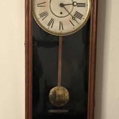 Long case wall clock measuring 42