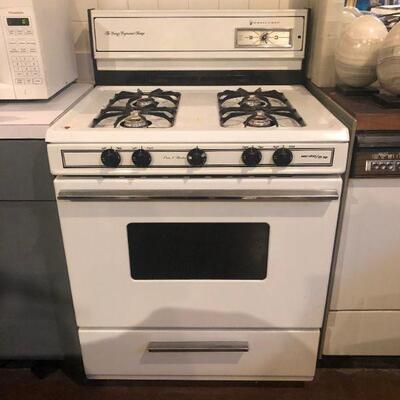 Gas top stove/oven with featured warmer. Works great but needs cleaning. $100