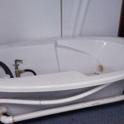 New therapeutic whirlpool tub with heated jets.