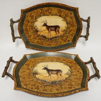 1109	TWO SERVING TRAYS W/ RUSTED TWIG STYLE HANDLES & STAG IMAGES IN CENTER. 23 IN W 15 1/2 IN H
