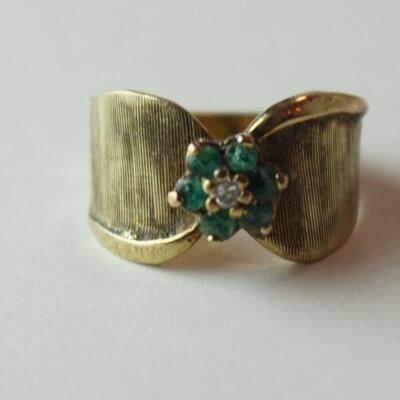 1277	MARKED 14K GOLD RING WITH 6 EMERALDS AND DIAMOND FLOWER, STONES UNTESTED. APPROXIMATE WEIGHT WITH STONES 3.178	100	200	50	PLEASE PAY...