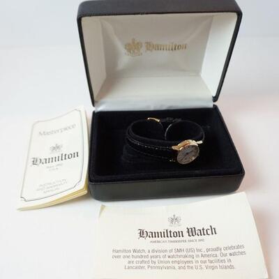 1254	HAMILTON MASTERPIECE LADIES CALENDAR WATCH IN BOX WITH PAPERWORK	100	300	50	PLEASE PAY ATTENTION FOR DAILY ADDITIONS TO THIS SALE....