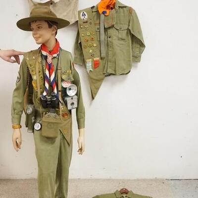 1225	MANNEQUIN CLOTHED IN BOY SCOUTS UNIFORM, SASH W/ PATCHES, BOY SCOUTS CAMERA, CANTEEN, FLASH LIGHT, BOY SCOUTS FIRST AIDE KIT, SCARF...