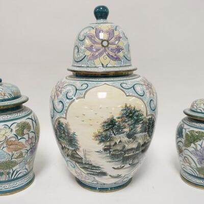 1120	THREE THIA DECORATED POTTERY COVERED URNS. TALLEST IS 18 IN 
