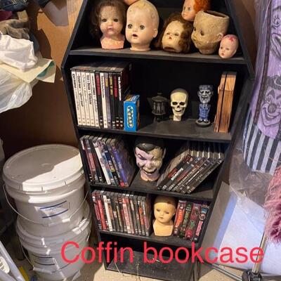 Coffin bookcase 
Doll heads 