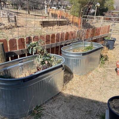 Large metal containers used for livestock - planting etc 