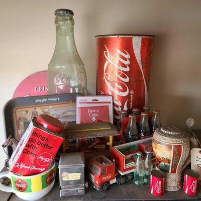 10	
Coca-Cola Collectables
Salt & Pepper Shakers. Stein. 6 Pack Of Coke Bottles. Horse & Buggy. Tray. Bottle Opener Magnet. Truck. Mug....