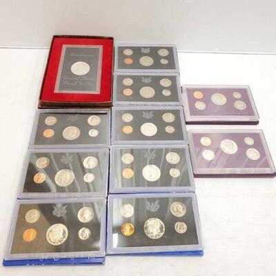 #662 â€¢ 10 Proof Sets And Eisenhower Dollar years 1969, 1970, 1971, 1990 and 1991.