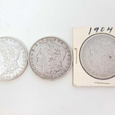 562	

2 1900 Morgan Silver Dollars And 1904 Morgan Silver Dollar
2 1900 Morgan Silver Dollars And 1904 Morgan Silver Dollar