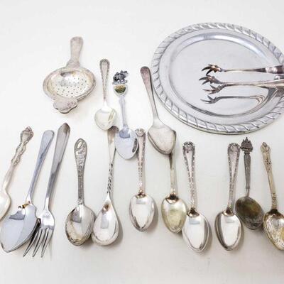 2498	

Collectible Spoons and more
13 Spoons 1 Small Plate, 1 fork, 1 pair of tongs, and one small sifter