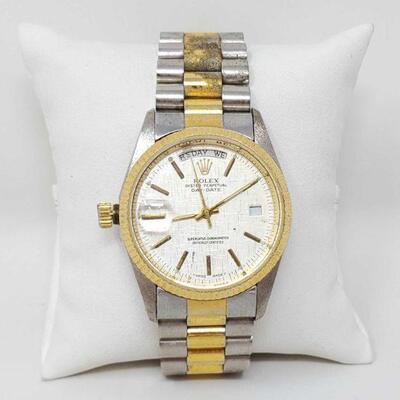 2432	

Rolex Oyster Perpetual Watch
Rolex Oyster Perpetual Watch